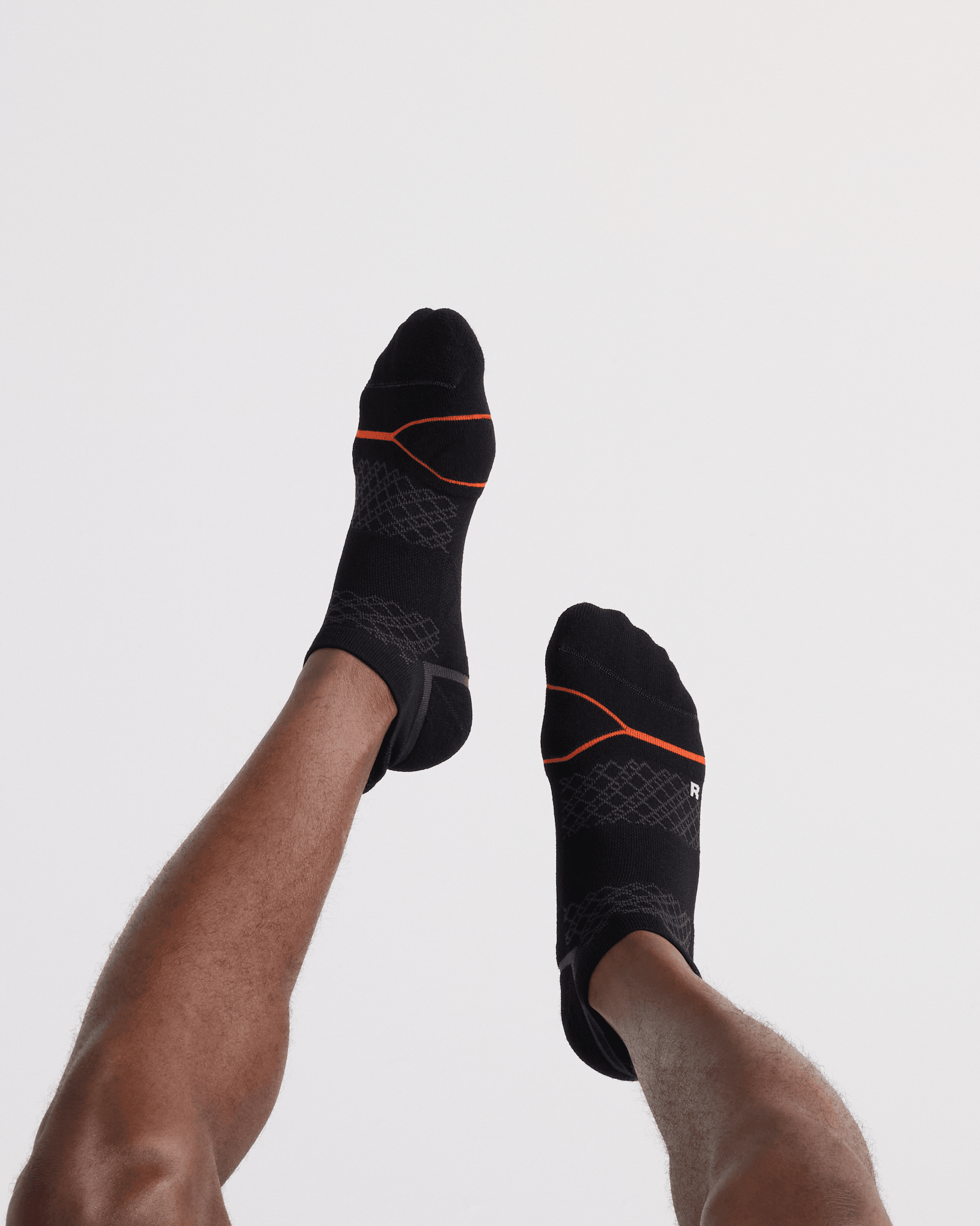 Back - Model wearing Foot Hold Mid-Weight Low Show Sock in Black