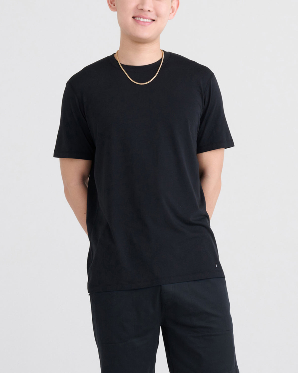 Front - Model wearing Droptemp Cooling Cotton Tee in Black