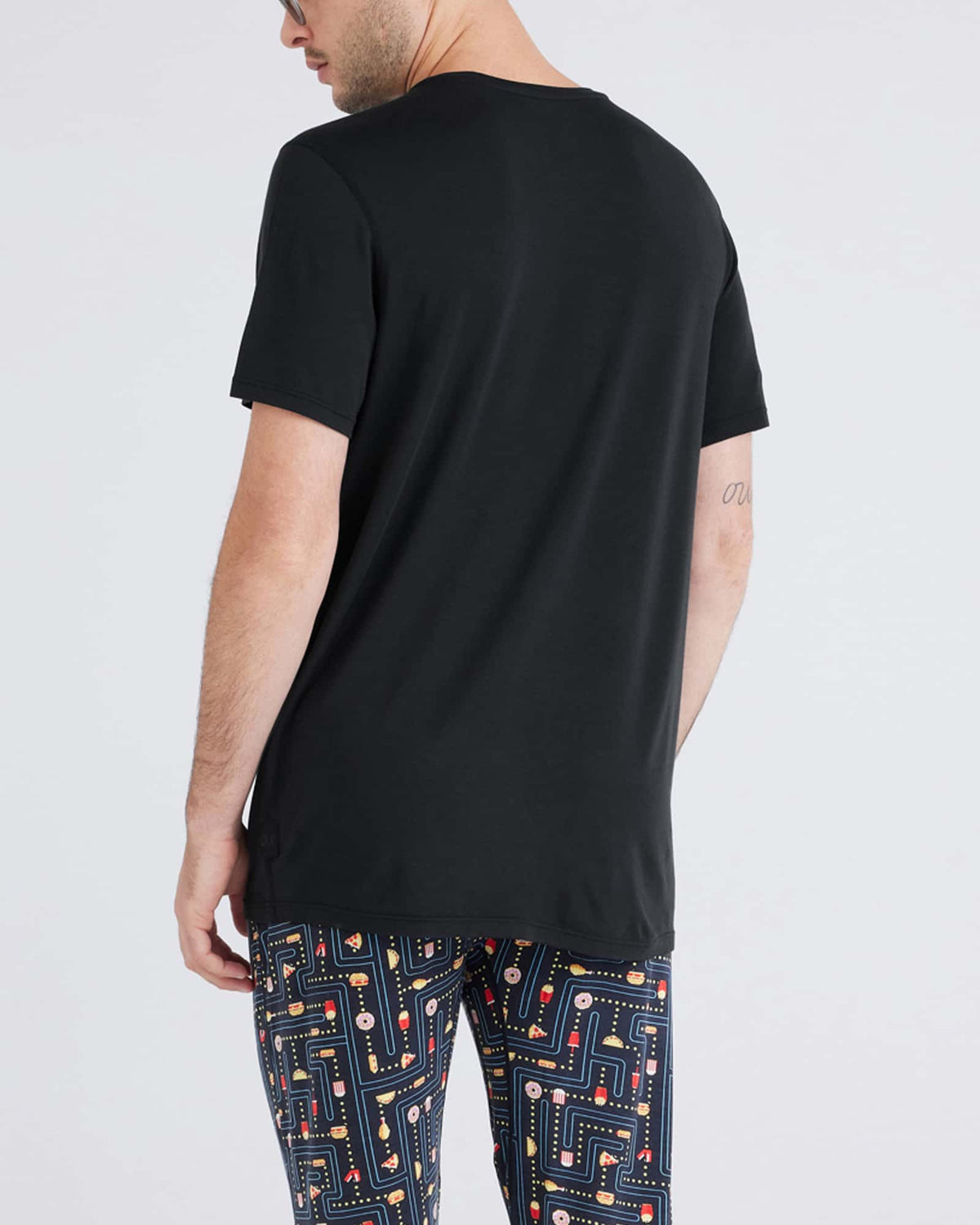 Back - Model wearing Snooze Short Sleeve Tee in Black