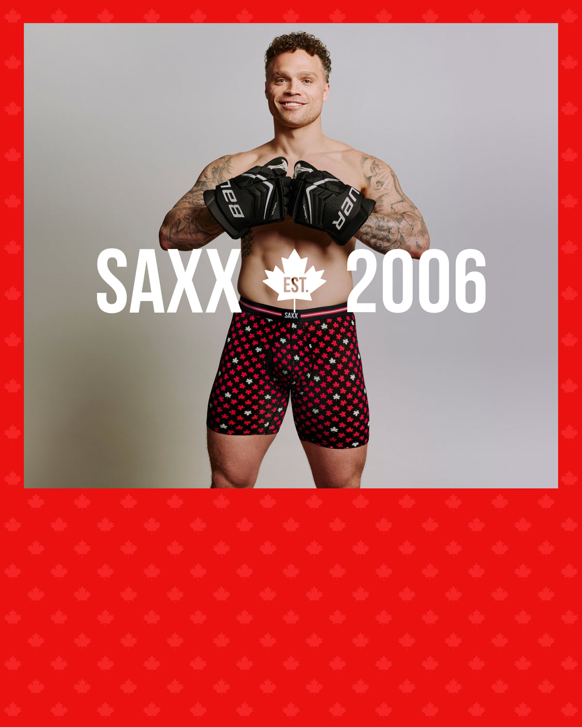 Max Domi wearing SAXX underwear with a red maple leaf pattern on a plain background.