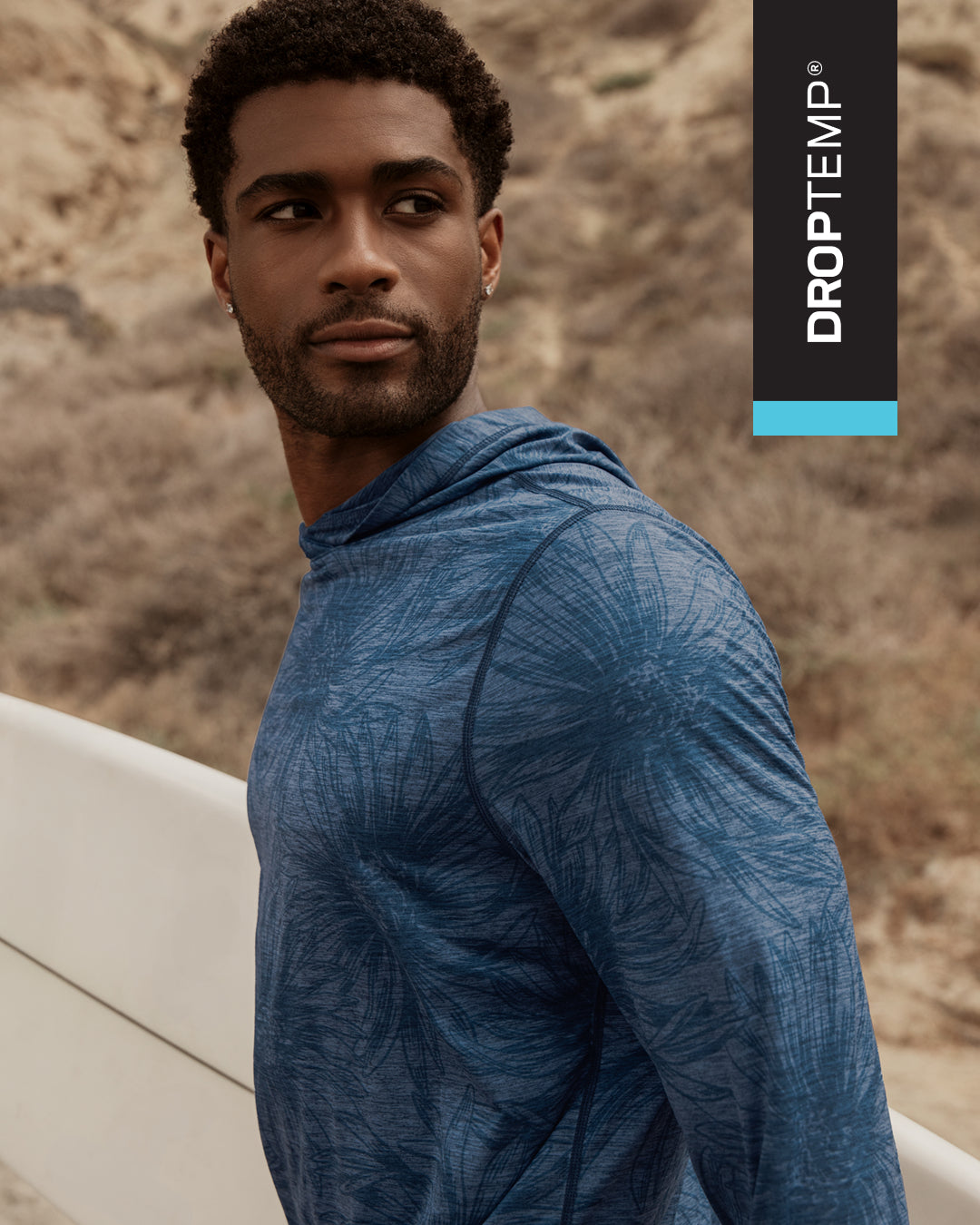 Model wearing a blue long sleeve top outdoors highlighting DropTemp apparel designed for cooling and moisture control