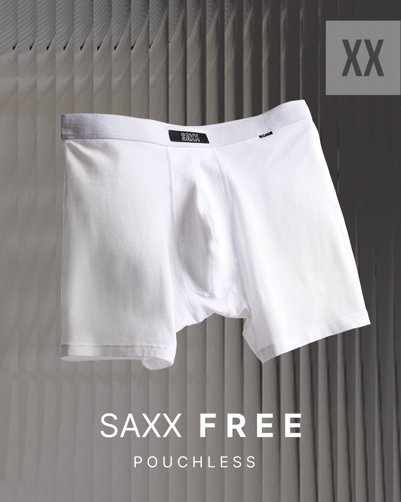 White SAXX FREE pouchless boxer briefs shown against a gray pleated background with 'XX' in the top right and 'SAXX FREE POUCHLESS' text at the bottom.