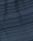 Close-up of blue fabric with a subtle pattern