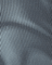 Close-up of textured gray fabric with thin lines