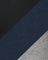 Close-up of fabric with a diagonal stripe pattern transitioning from black to blue to gray.