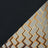 Swatch of two fabrics: a zigzag pattern, and black