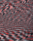 Close-up of a fabric with a red, black, and white pattern
