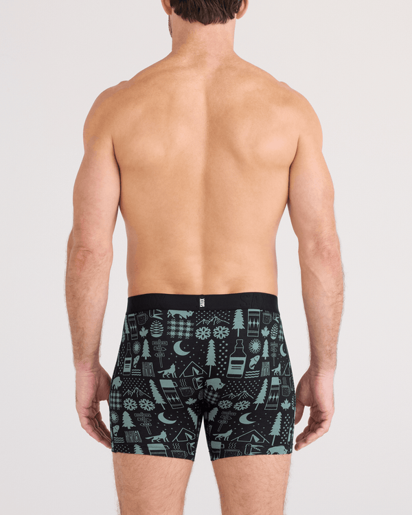 Back - Model wearing  DropTemp Cooling Cotton Boxer Brief Fly in Camp Stamps-Black