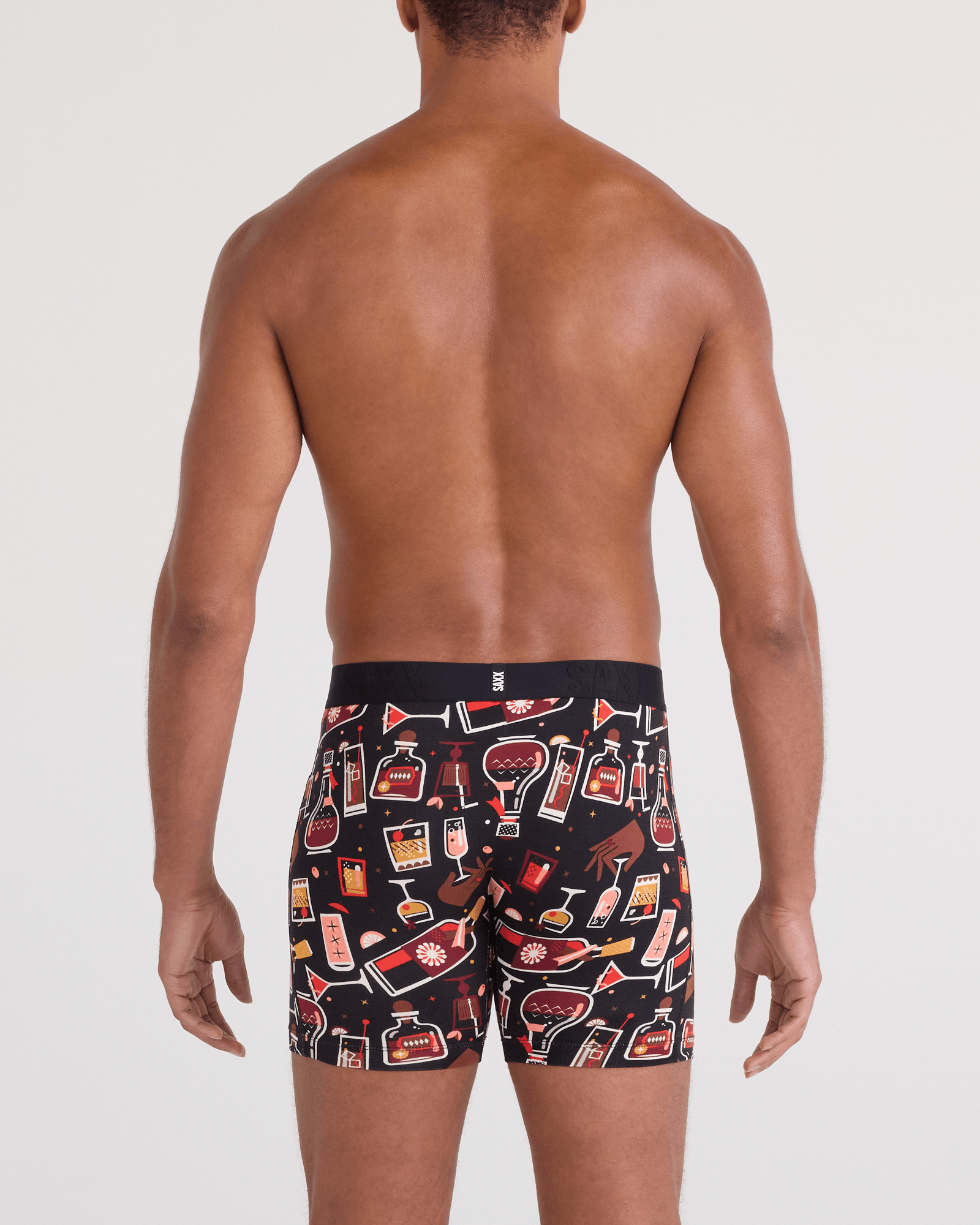 Back - Model wearing  DropTemp Cooling Cotton Boxer Brief Fly in Host With The Most-Black