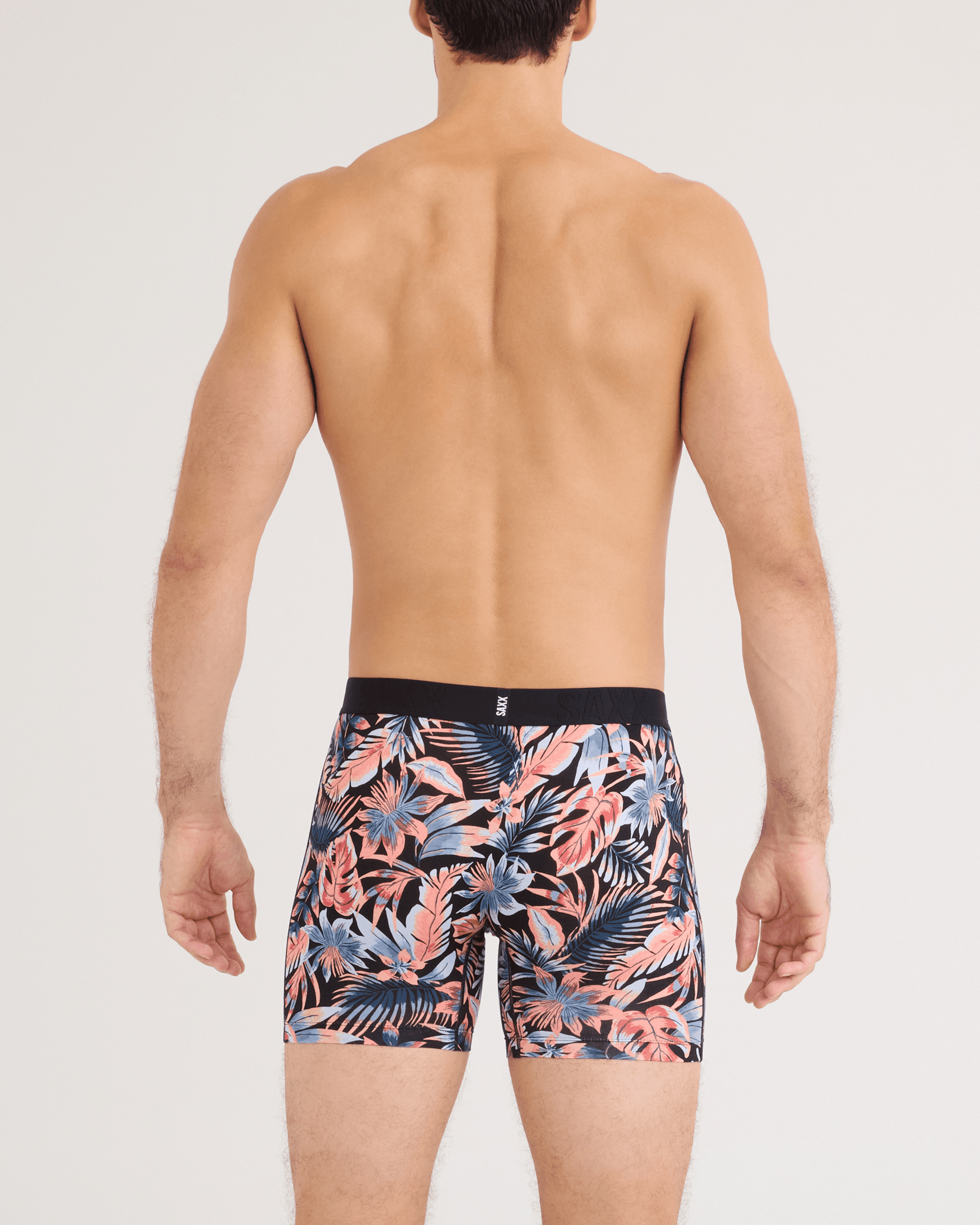 Back - Model wearing DropTemp Cooling Cotton Boxer Brief in Palm Passion-Black