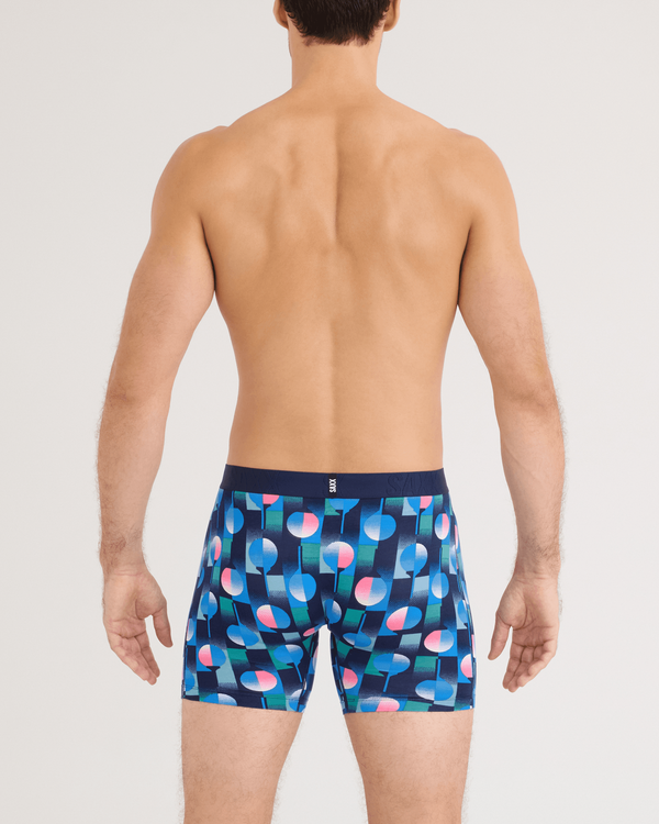 Front - Model wearing DropTemp Cooling Cotton Boxer Brief in Tee Up-Maritime Blue