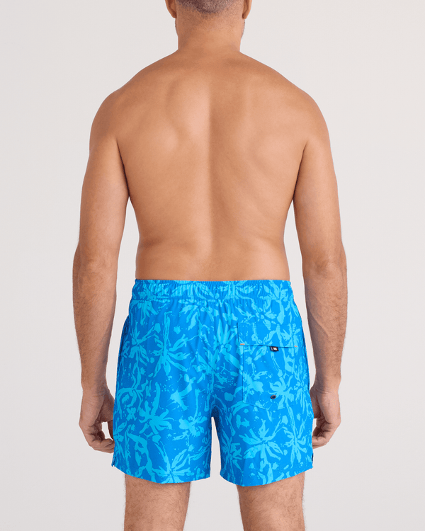 Back - Model wearing  Oh Buoy 2N1 Swim Trunk 5" in Splash Palms-Bold Blue